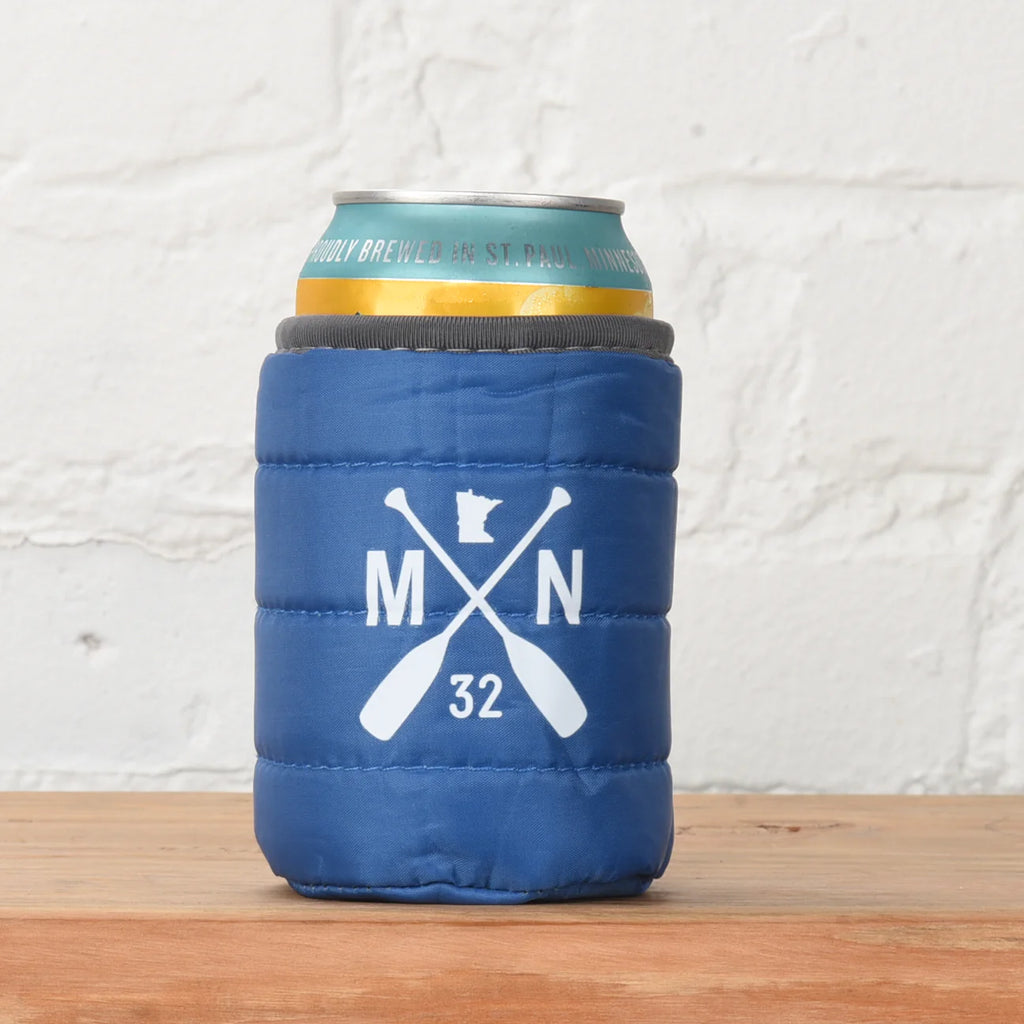 blue can coozie made to look like a sleeping bag.  oars, minnesota shape and letters M, N on it 