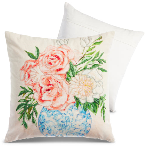 decorative white pillow with pink and white flowers in a blue vase 