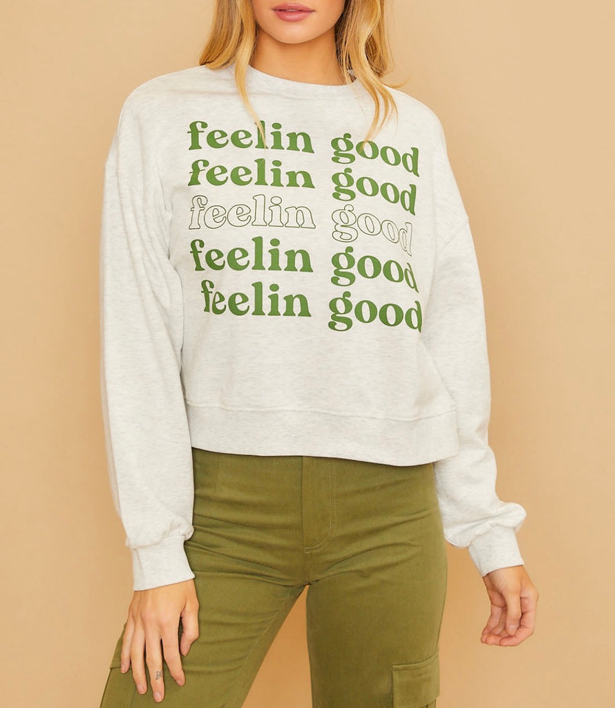 heather grey sweater that says feelin good