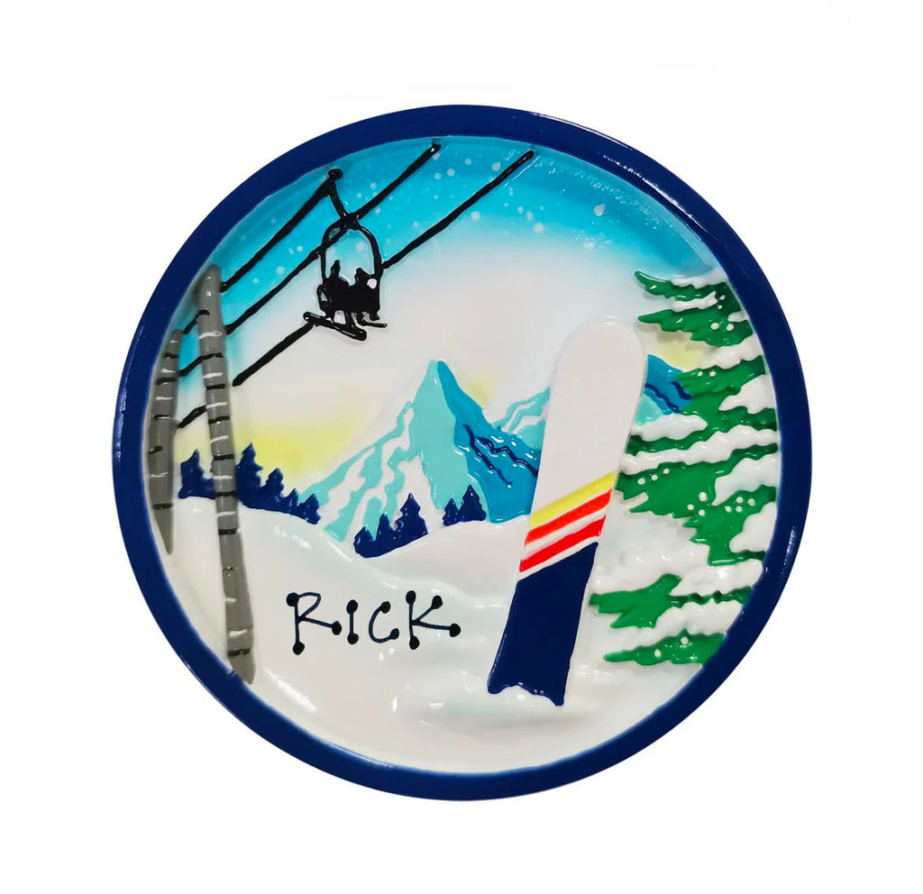 a blue and white plate with rick written on it